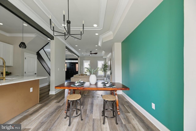 2817 Ulman Ave, Baltimore, MD 21215 - kitchen with ornamental molding, a chandelier, wood finished floors, baseboards, and recessed lighting