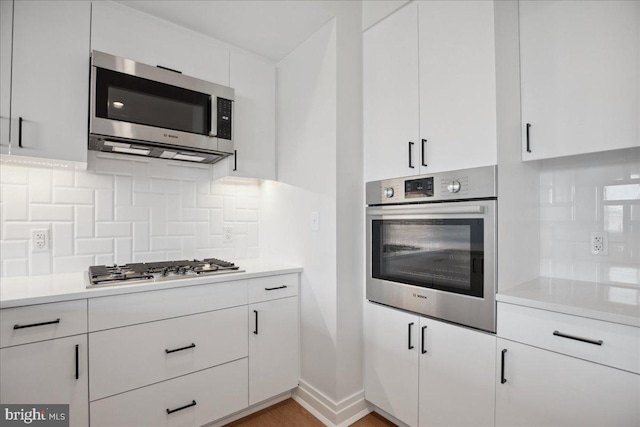 923 V St NW Unit 602, Washington, DC 20001 - kitchen featuring appliances with stainless steel finishes, light countertops, and white cabinets