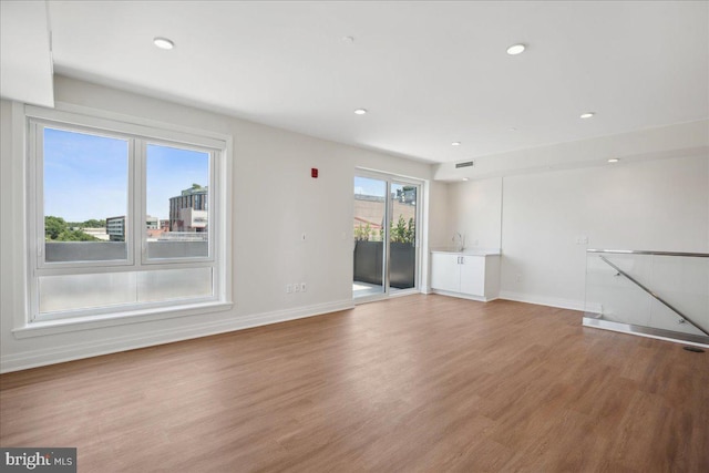 923 V St NW Unit 602, Washington, DC 20001 - unfurnished living room featuring wood finished floors and recessed lighting