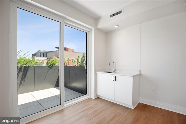 923 V St NW Unit 602, Washington, DC 20001 - indoor wet bar featuring light wood finished floors and baseboards