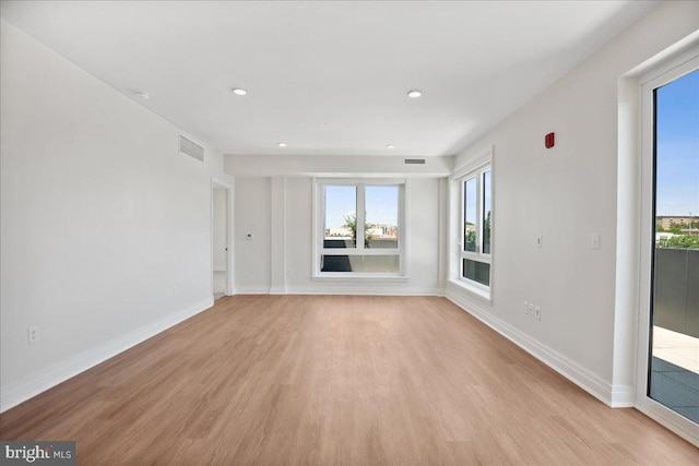 923 V St NW Unit 602, Washington, DC 20001 - unfurnished living room featuring light wood-type flooring, healthy amount of natural light, and recessed lighting