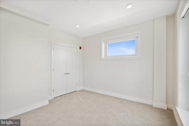 923 V St NW Unit 602, Washington, DC 20001 - unfurnished bedroom with light carpet, a closet, and recessed lighting