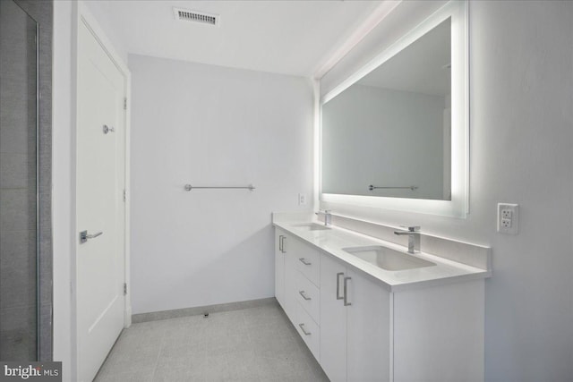 923 V St NW Unit 602, Washington, DC 20001 - bathroom featuring double vanity and baseboards