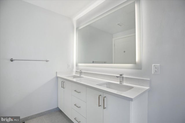 923 V St NW Unit 602, Washington, DC 20001 - bathroom featuring double vanity and baseboards
