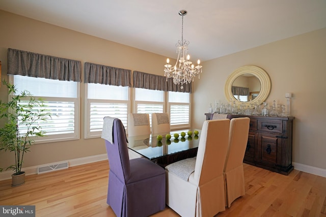 102 Morgan Way, Milton, DE 19968 - dining area with light wood finished floors, a chandelier, and plenty of natural light