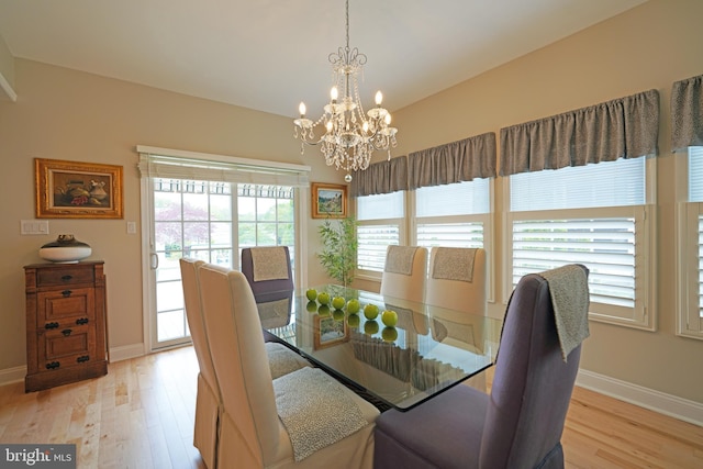 102 Morgan Way, Milton, DE 19968 - dining area featuring light wood-style flooring, a chandelier, and baseboards