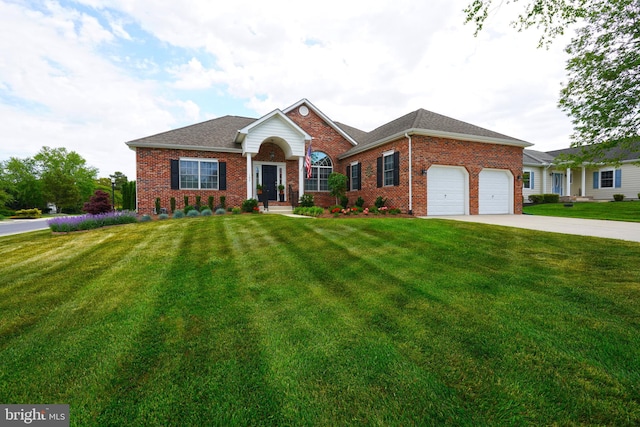 102 Morgan Way, Milton, DE 19968 - view of front of property with brick siding, a front lawn, an attached garage, and concrete driveway