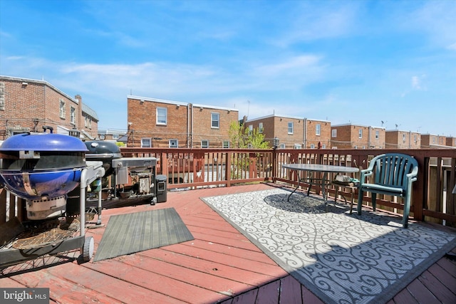 deck featuring a residential view and area for grilling