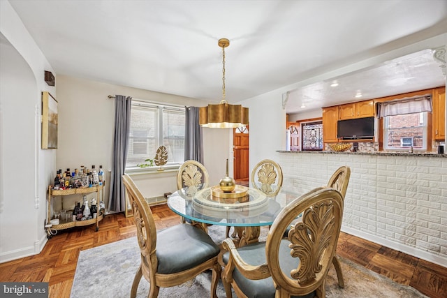 dining space featuring baseboards, recessed lighting, and a wealth of natural light