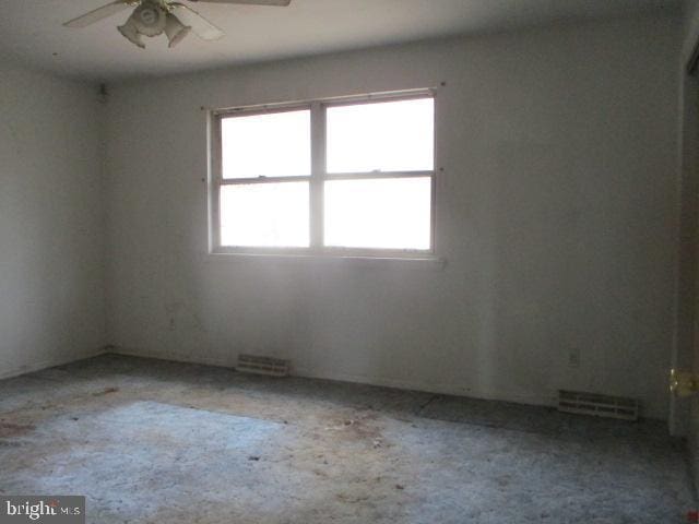 2014 Leland Ave, Baltimore, MD 21220 - carpeted empty room featuring a ceiling fan and visible vents