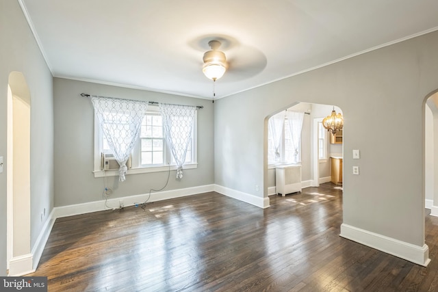 208 Farragut St NW Unit 104, Washington, DC 20011 - spare room featuring arched walkways, crown molding, dark wood-type flooring, baseboards, and a chandelier