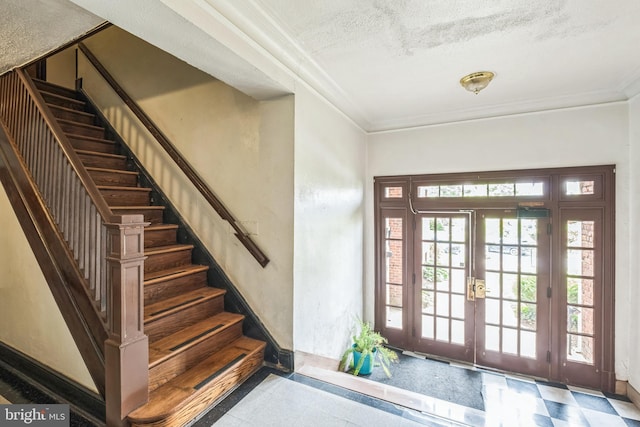 208 Farragut St NW Unit 104, Washington, DC 20011 - entryway with ornamental molding, stairs, french doors, baseboards, and a textured ceiling