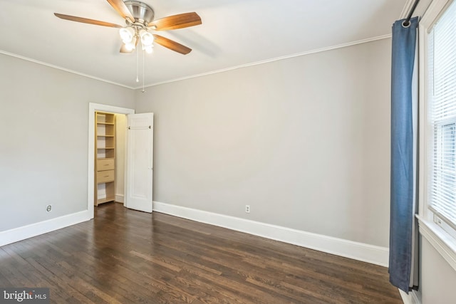 208 Farragut St NW Unit 104, Washington, DC 20011 - spare room with ceiling fan, baseboards, dark wood-style flooring, and ornamental molding