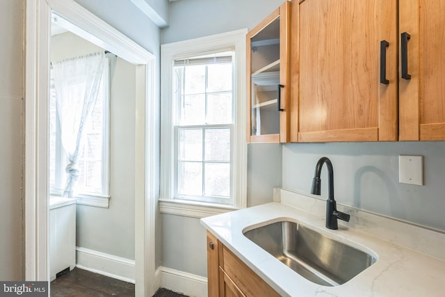 208 Farragut St NW Unit 104, Washington, DC 20011 - kitchen with a sink, plenty of natural light, and light stone counters
