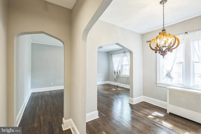 208 Farragut St NW Unit 104, Washington, DC 20011 - unfurnished dining area with radiator heating unit, arched walkways, a chandelier, and hardwood / wood-style floors