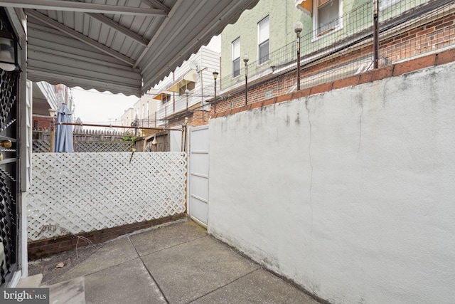 2341 S Hicks St, Philadelphia, PA 19145 - view of home's exterior featuring fence, stucco siding, and brick siding