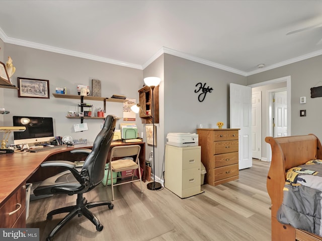office space featuring baseboards, ornamental molding, and light wood-type flooring