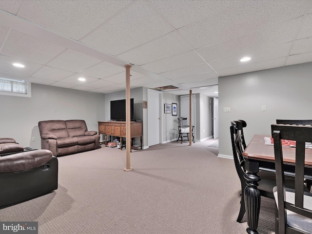 interior space featuring baseboards, recessed lighting, and a paneled ceiling