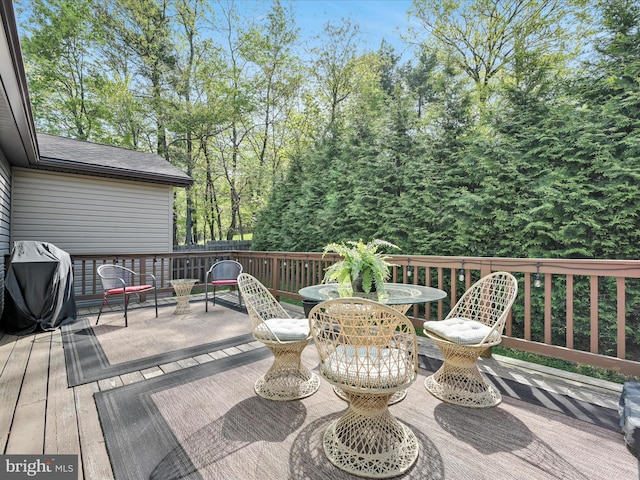 wooden deck featuring grilling area