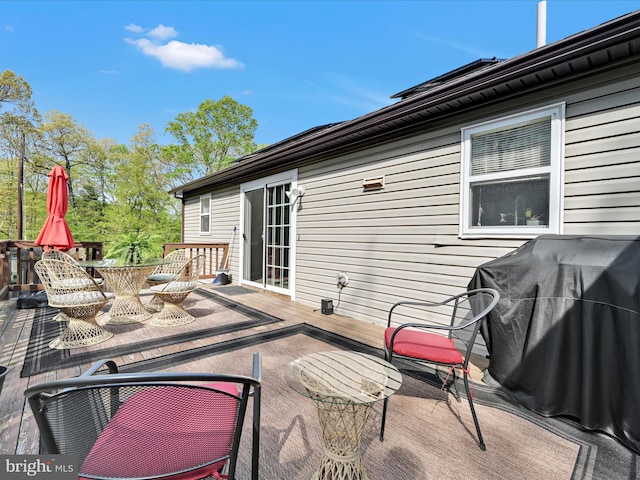 view of patio featuring a wooden deck and area for grilling