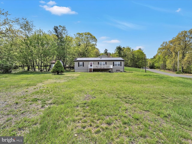view of yard featuring a wooden deck