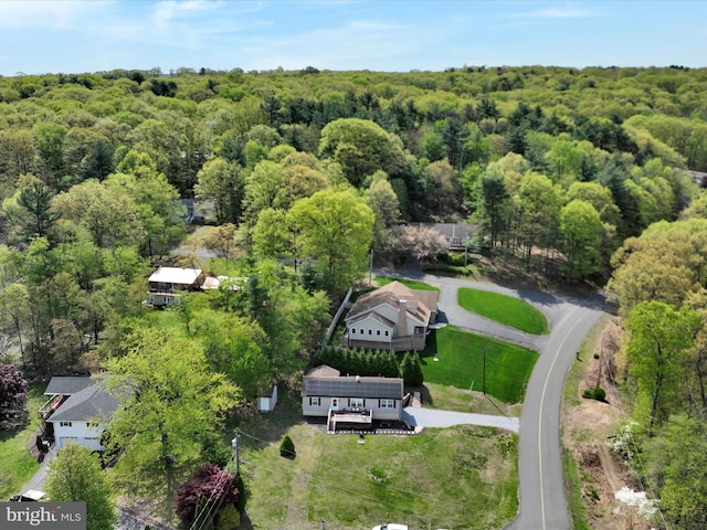 aerial view with a wooded view