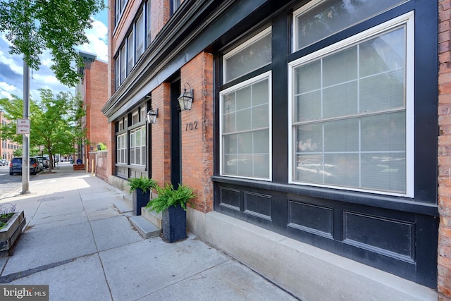 702 S Wolfe St Unit 5, Baltimore, MD 21231 - view of property exterior featuring brick siding