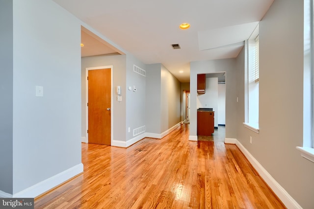 702 S Wolfe St Unit 5, Baltimore, MD 21231 - unfurnished living room with light wood finished floors, baseboards, and recessed lighting