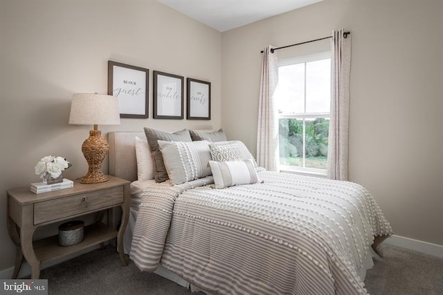 bedroom with carpet flooring, baseboards, and multiple windows