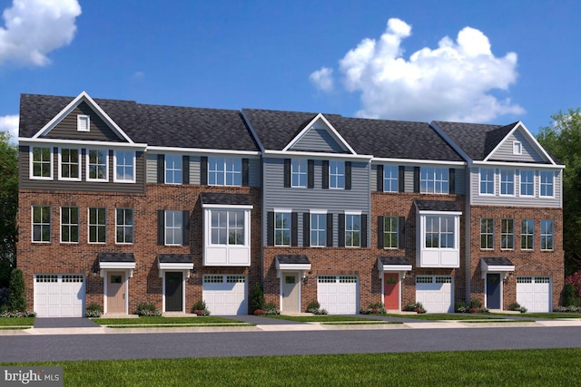view of front facade with a garage and brick siding