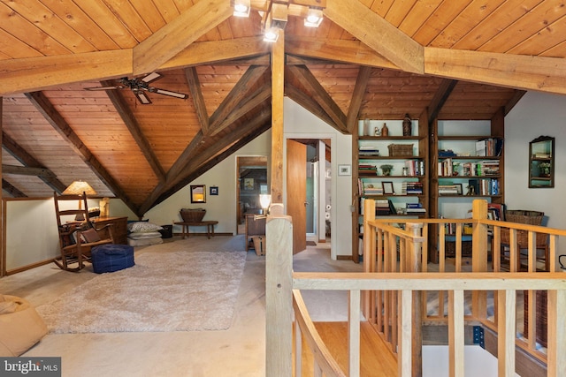 interior space with lofted ceiling with beams, wood ceiling, ceiling fan, and carpet flooring