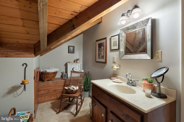 bathroom with wood ceiling, beamed ceiling, and vanity
