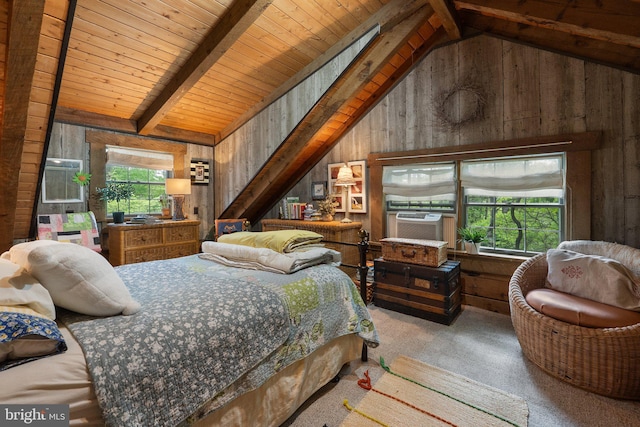 bedroom with wood walls, vaulted ceiling with beams, and carpet
