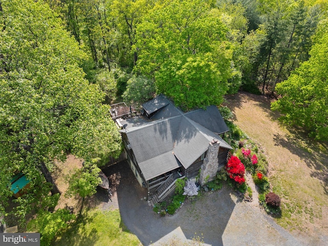 aerial view featuring a wooded view