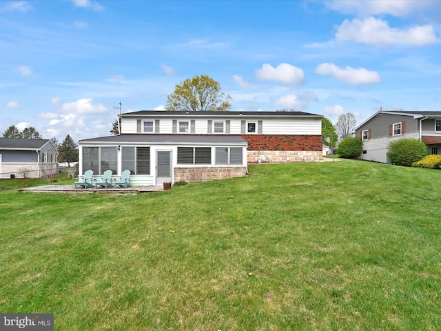 rear view of house featuring fence, a patio, and a yard