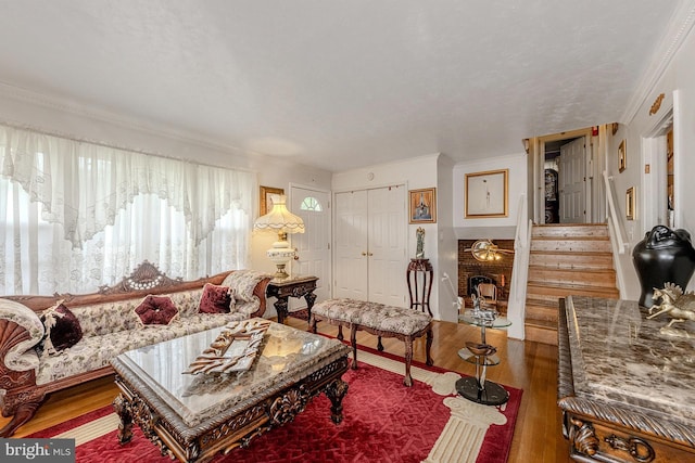 7202 Good Luck Rd, Lanham, MD 20706 - living area featuring wood finished floors, ornamental molding, and stairway