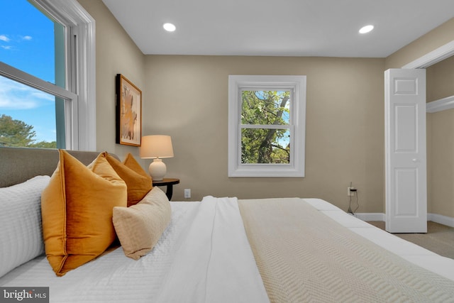 bedroom with recessed lighting and baseboards