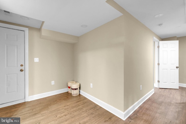 interior space featuring light wood-style floors and baseboards