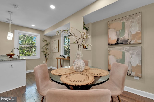 dining space featuring recessed lighting, baseboards, and dark wood-type flooring
