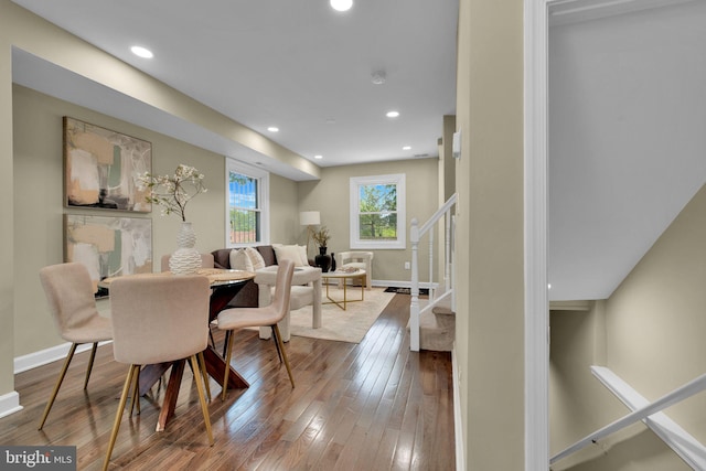dining space featuring stairs, recessed lighting, baseboards, and hardwood / wood-style flooring