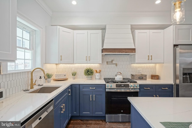2326 Gerritt St, Philadelphia, PA 19146 - kitchen featuring a sink, premium range hood, stainless steel appliances, and blue cabinetry
