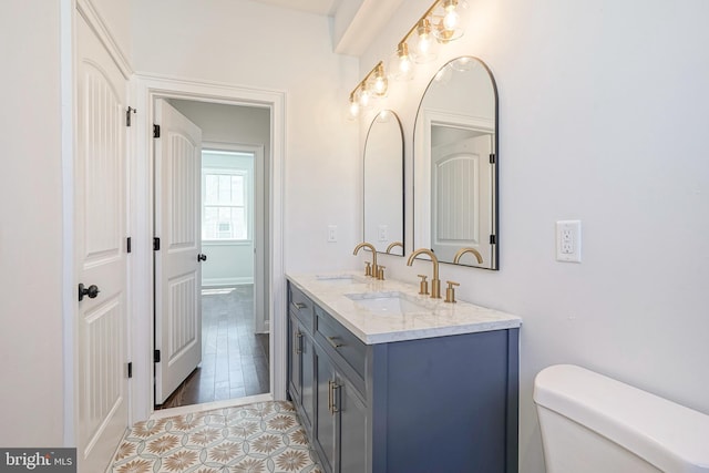 2326 Gerritt St, Philadelphia, PA 19146 - bathroom with double vanity, a sink, tile patterned floors, and toilet