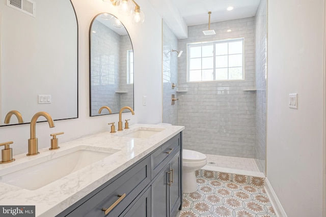 2326 Gerritt St, Philadelphia, PA 19146 - bathroom with toilet, tile patterned floors, visible vents, and a sink