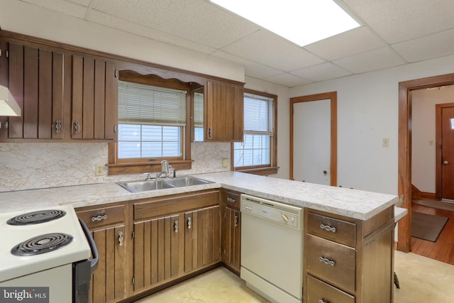 350 E Derry Rd, Hershey, PA 17033 - kitchen with white appliances, a drop ceiling, a sink, light countertops, and backsplash