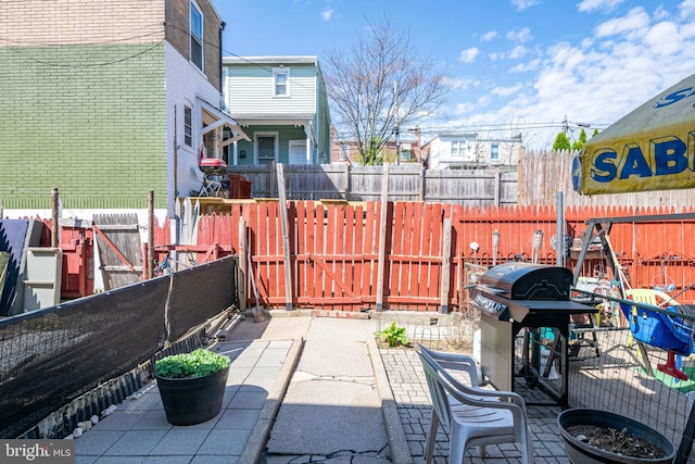 view of patio / terrace with fence and grilling area