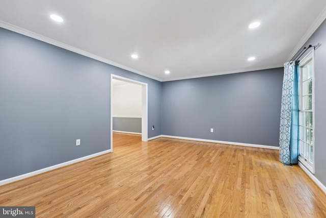 unfurnished room featuring baseboards, ornamental molding, light wood finished floors, and recessed lighting
