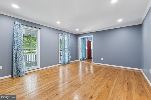unfurnished room featuring crown molding, recessed lighting, light wood-style flooring, and baseboards