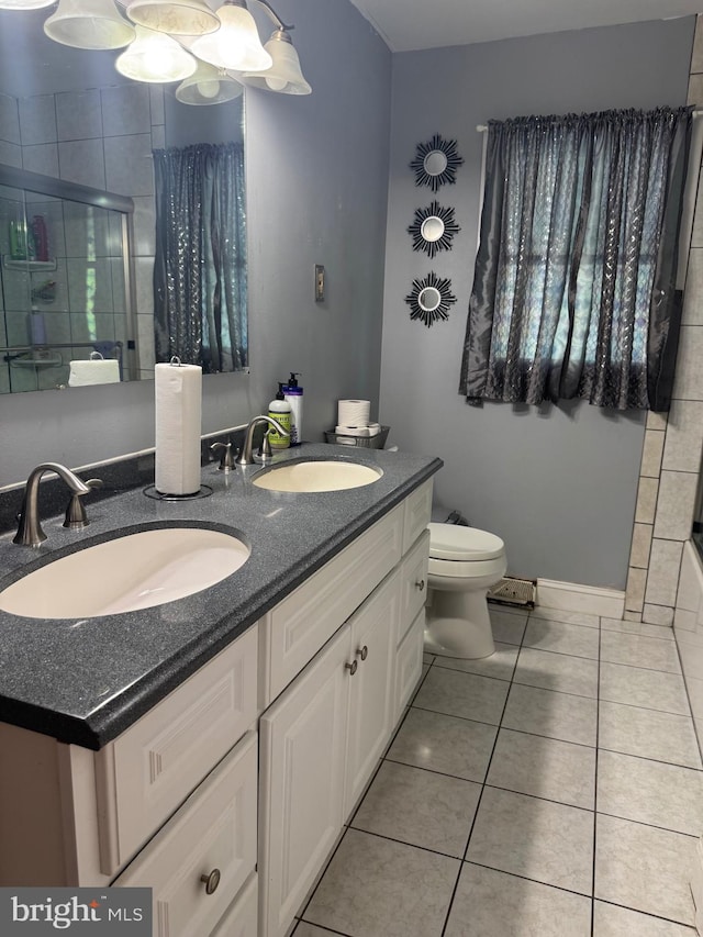 603 Leuckel Ave, Hamilton, NJ 08619 - full bath with a sink, tile patterned flooring, toilet, and tiled shower