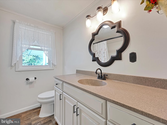 917 Houtztown Rd, Myerstown, PA 17067 - full bath with wood finished floors, vanity, baseboards, toilet, and ornamental molding
