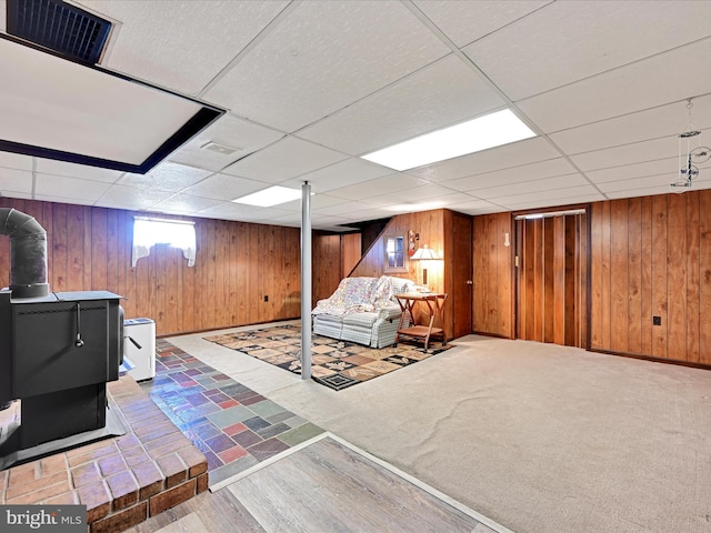 917 Houtztown Rd, Myerstown, PA 17067 - living room with baseboards, wood walls, a paneled ceiling, and visible vents